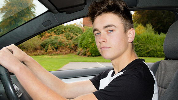 https://www.aurainsurance.co.uk/wp-content/uploads/2021/11/confident-young-male-driver-in-car.jpg